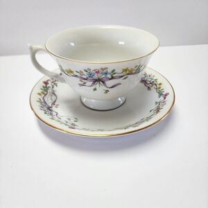 A Teleflora Gift Fine Porcelain Tea Cup and Saucer